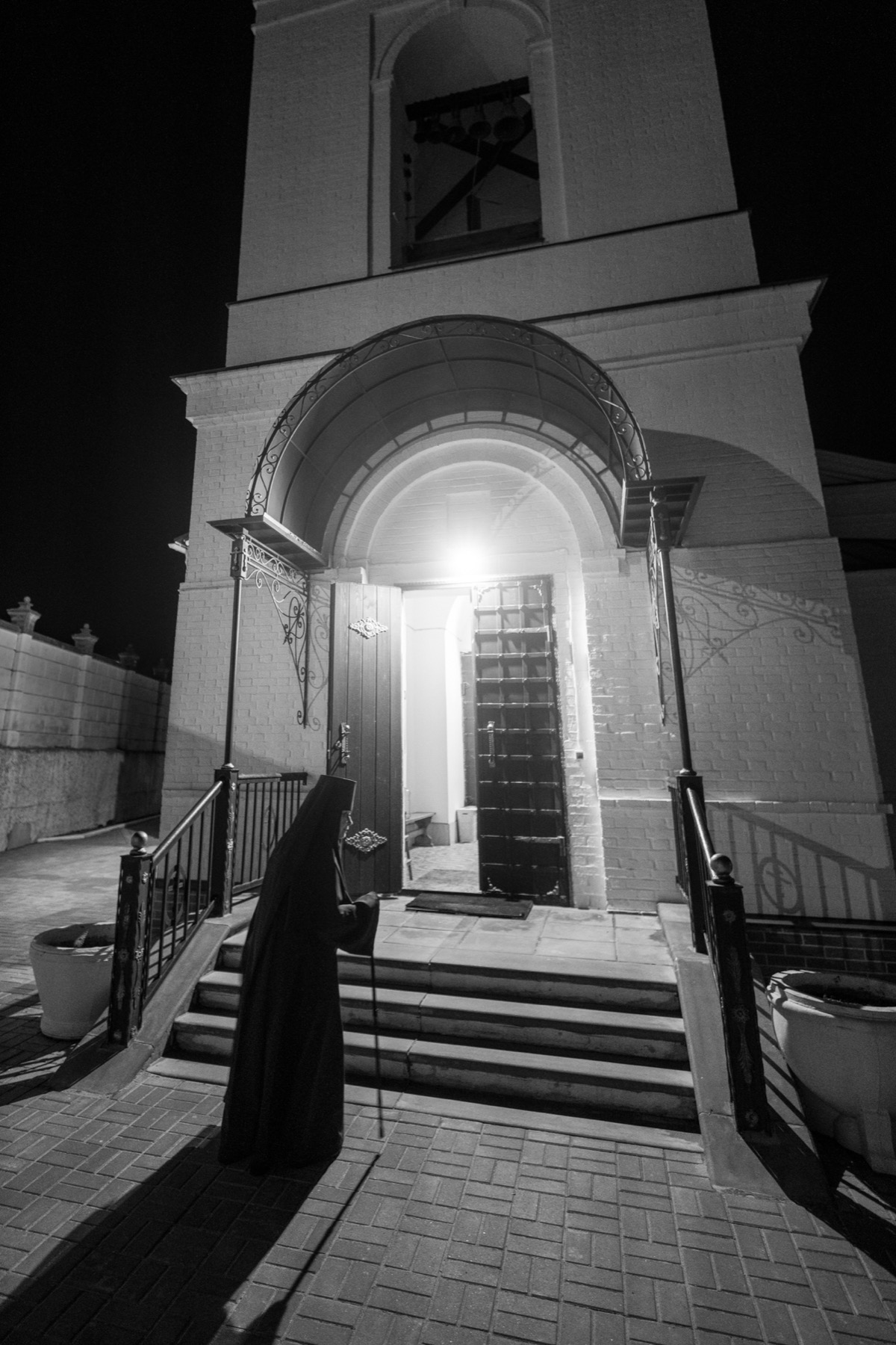 Figure at the entrance to sacred architecture
